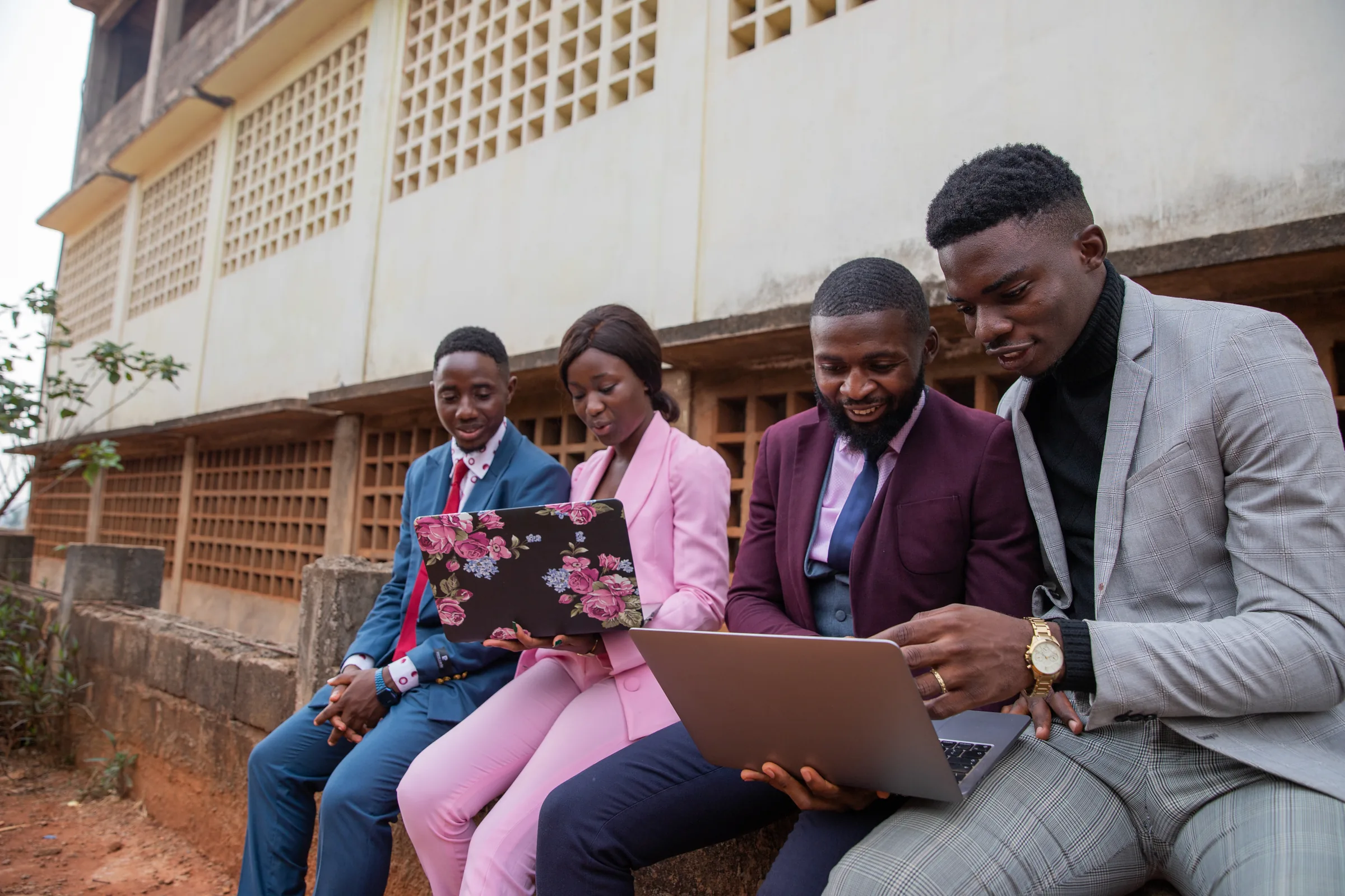 Team collaborating around a laptop
