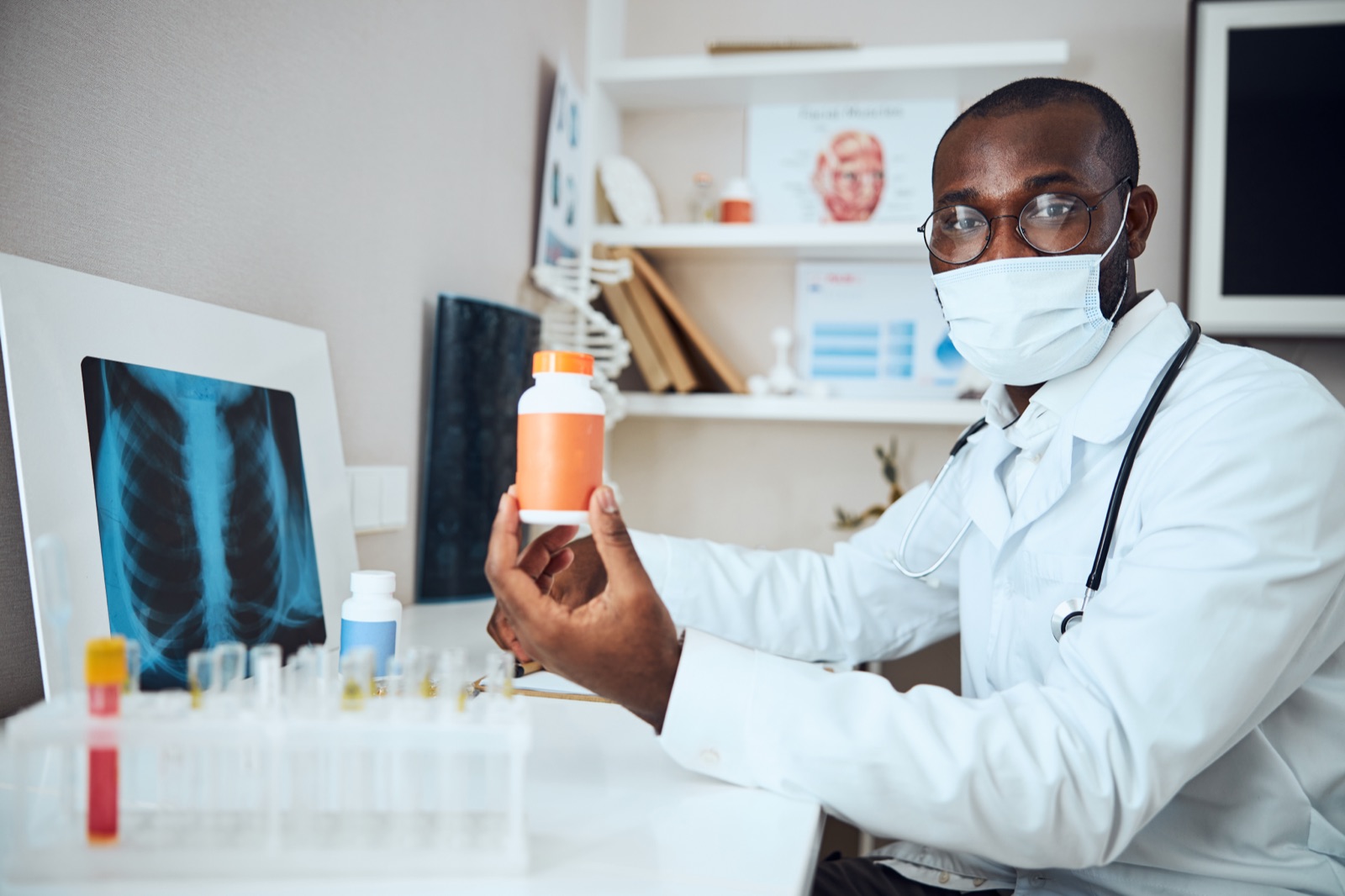 Medical professional holding medication in a clinic